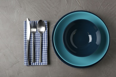 Photo of Beautiful table setting on grey background, flat lay