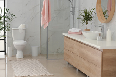 Photo of Interior of modern bathroom with toilet bowl