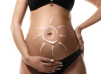 Pregnant woman with sun protection cream on her belly against white background, closeup