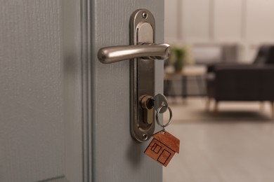 Photo of Closeup view of open door with key in room