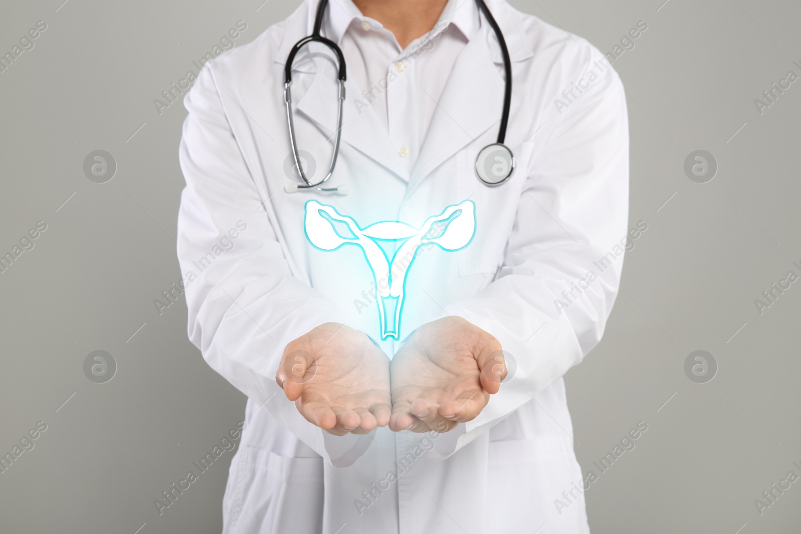 Image of Doctor and illustration of female reproductive system on grey background, closeup