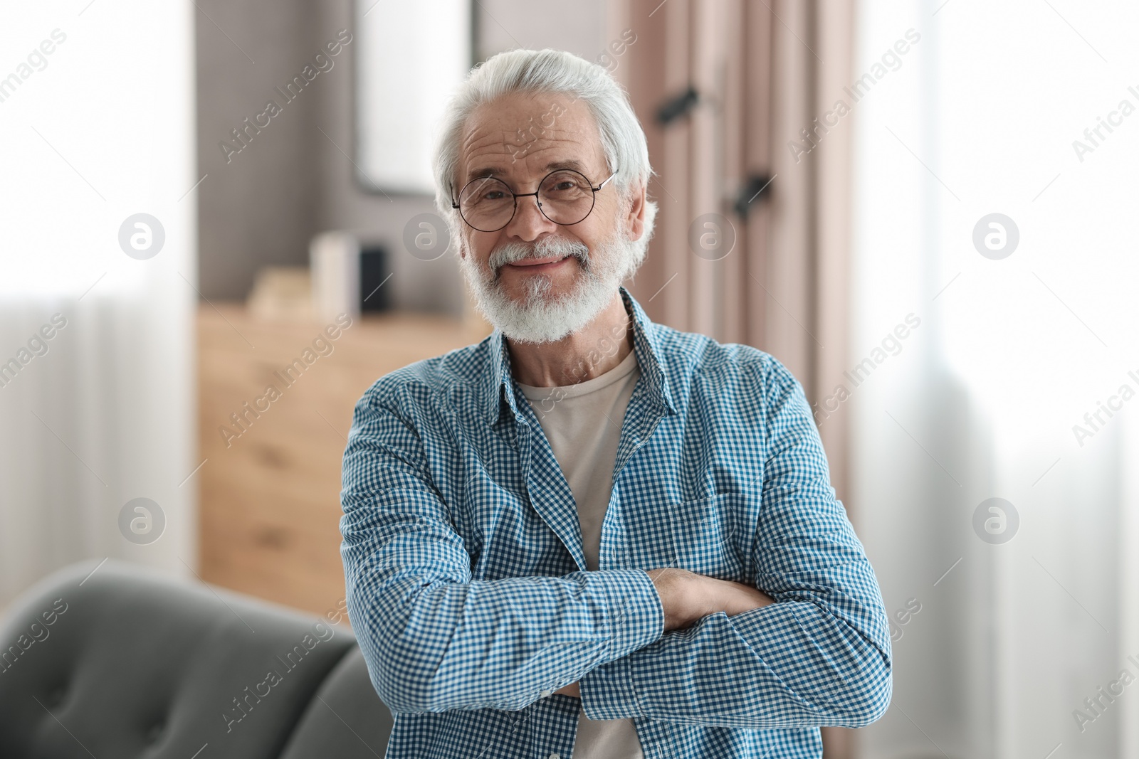 Photo of Portrait of happy grandpa with glasses indoors