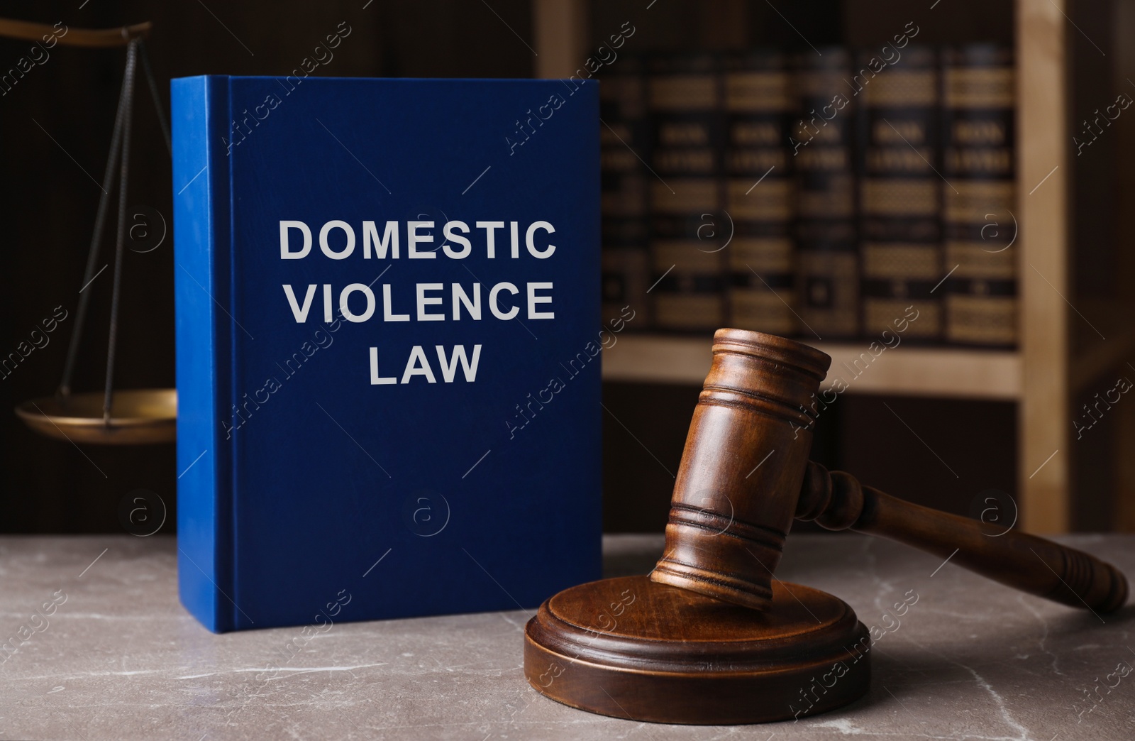 Image of Domestic violence law and gavel on grey marble table