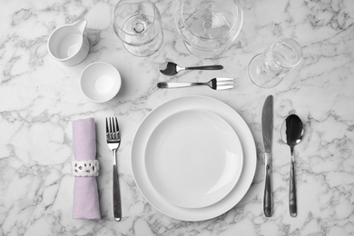 Photo of Stylish elegant table setting on marble background, top view