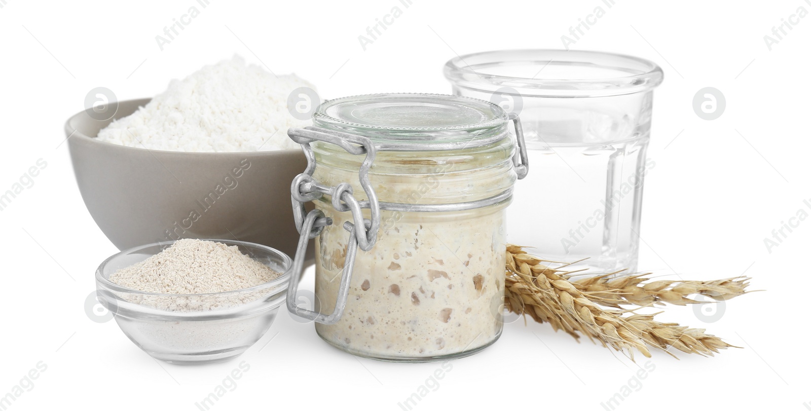 Photo of Leaven, flour, water and ears of wheat isolated on white