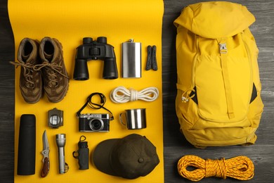 Flat lay composition with different camping equipment on color background. Traveler set