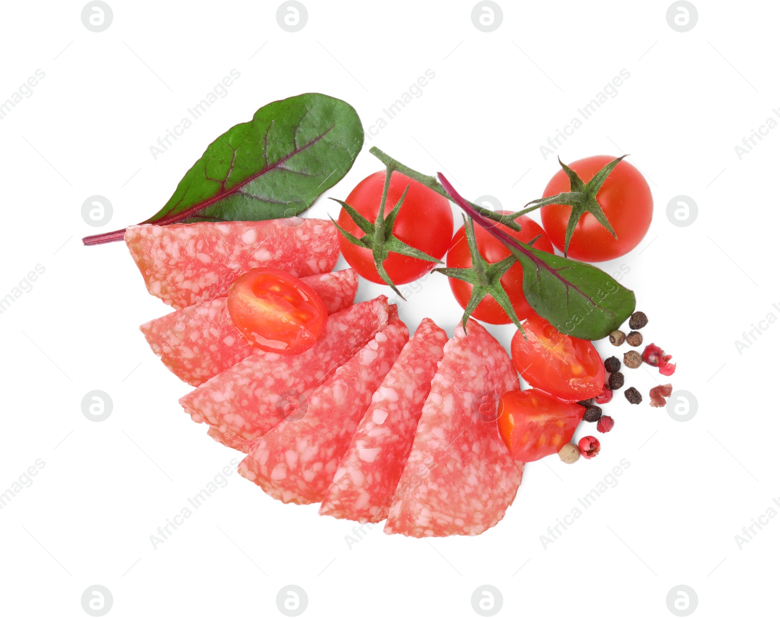 Photo of Slices of delicious salami, tomatoes, pepper and spinach isolated on white, top view