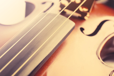 Image of Beautiful classic violin, closeup view. Musical instrument