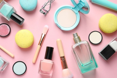 Photo of Flat lay composition with decorative cosmetics on color background