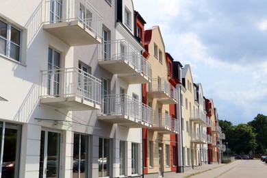 Modern houses with balconies on city street