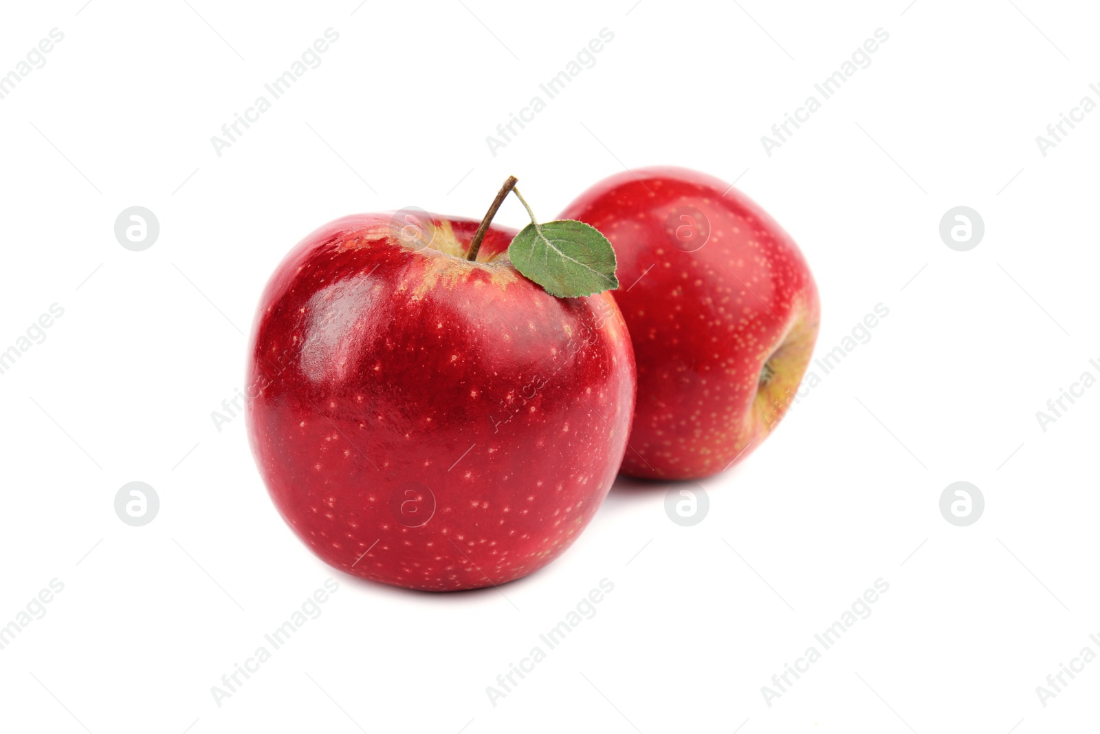 Photo of Ripe juicy red apples with leaf on white background