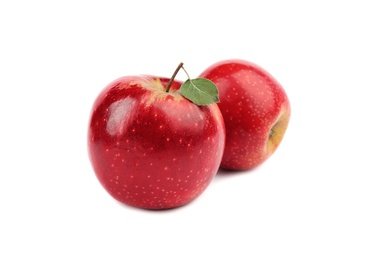 Photo of Ripe juicy red apples with leaf on white background