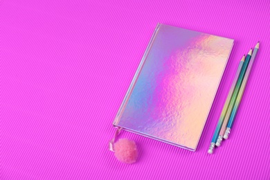 Photo of Beautiful notebook and pencils on color background. Space for text