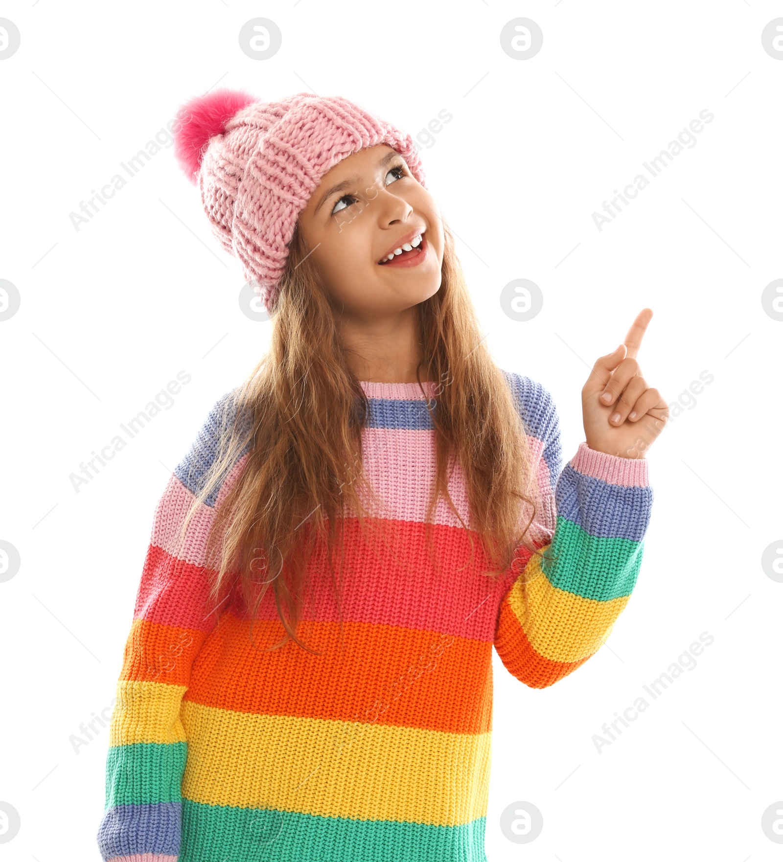 Photo of Cute little girl in warm clothes on white background. Winter vacation