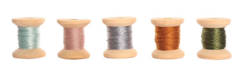 Set of colorful sewing threads on white background