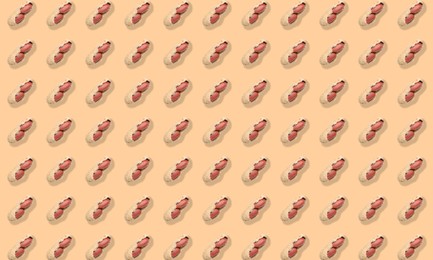 Image of Pattern of unpeeled peanuts on beige background