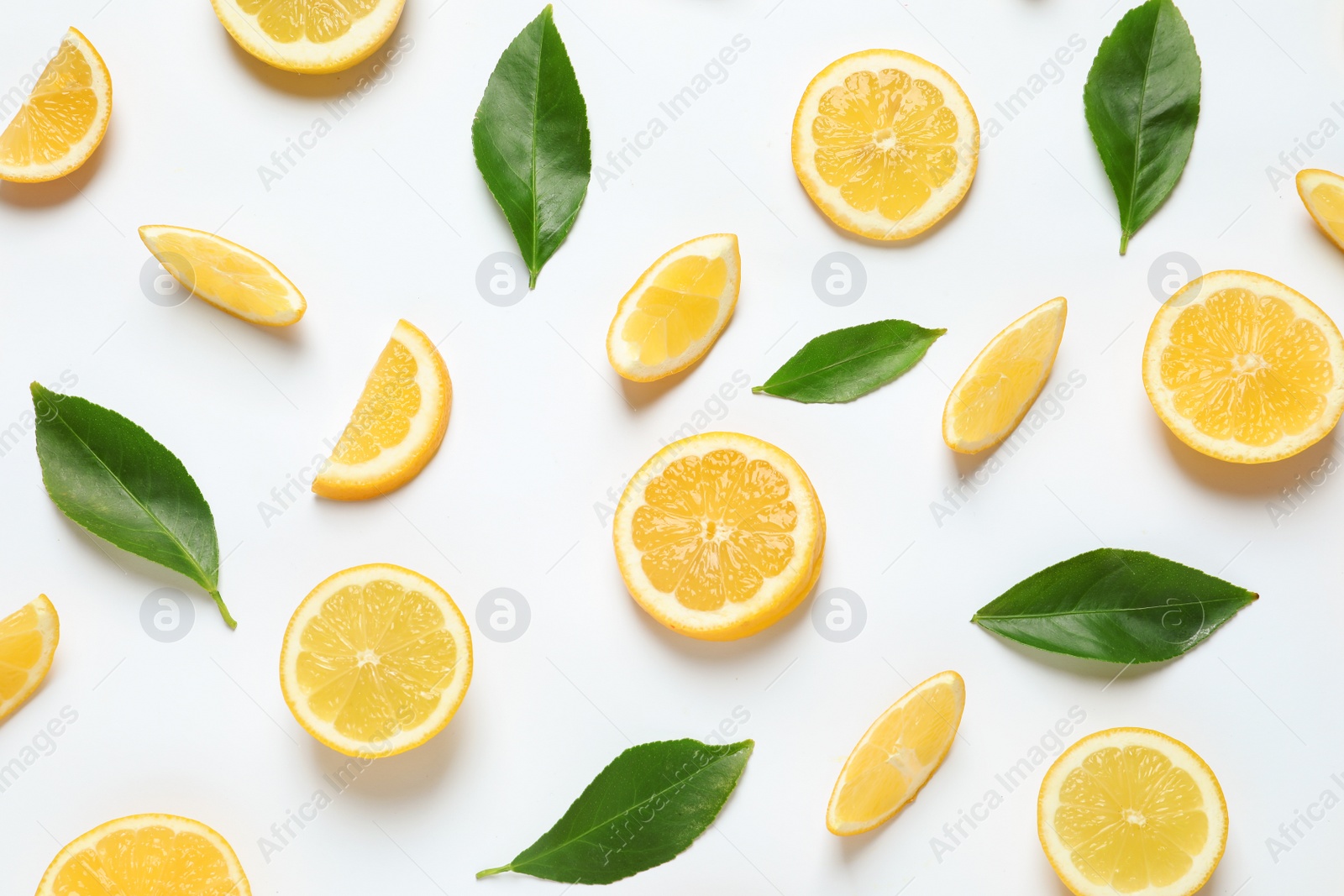 Photo of Fresh lemons and leaves on white background, top view. Citrus fruits