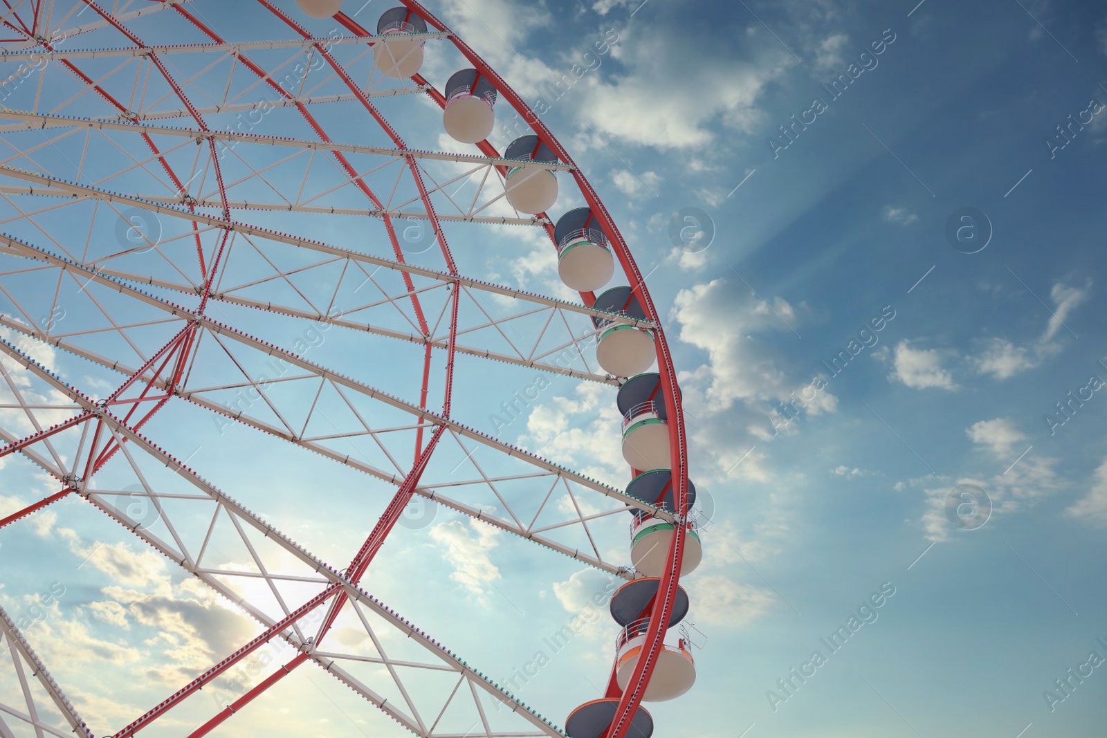 Photo of Beautiful large Ferris wheel outdoors, low angle view. Space for text