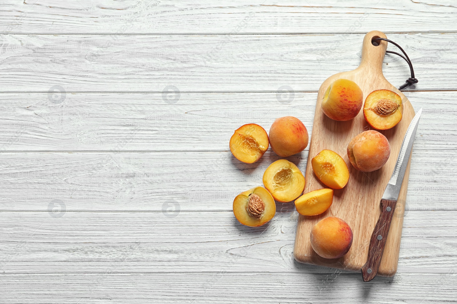 Photo of Flat lay composition with ripe peaches on wooden background