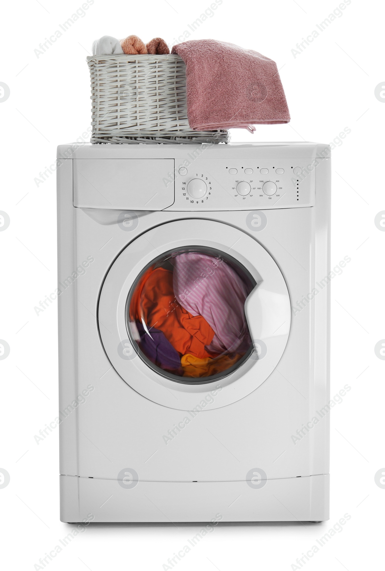 Photo of Modern washing machine with laundry and towels in basket on white background