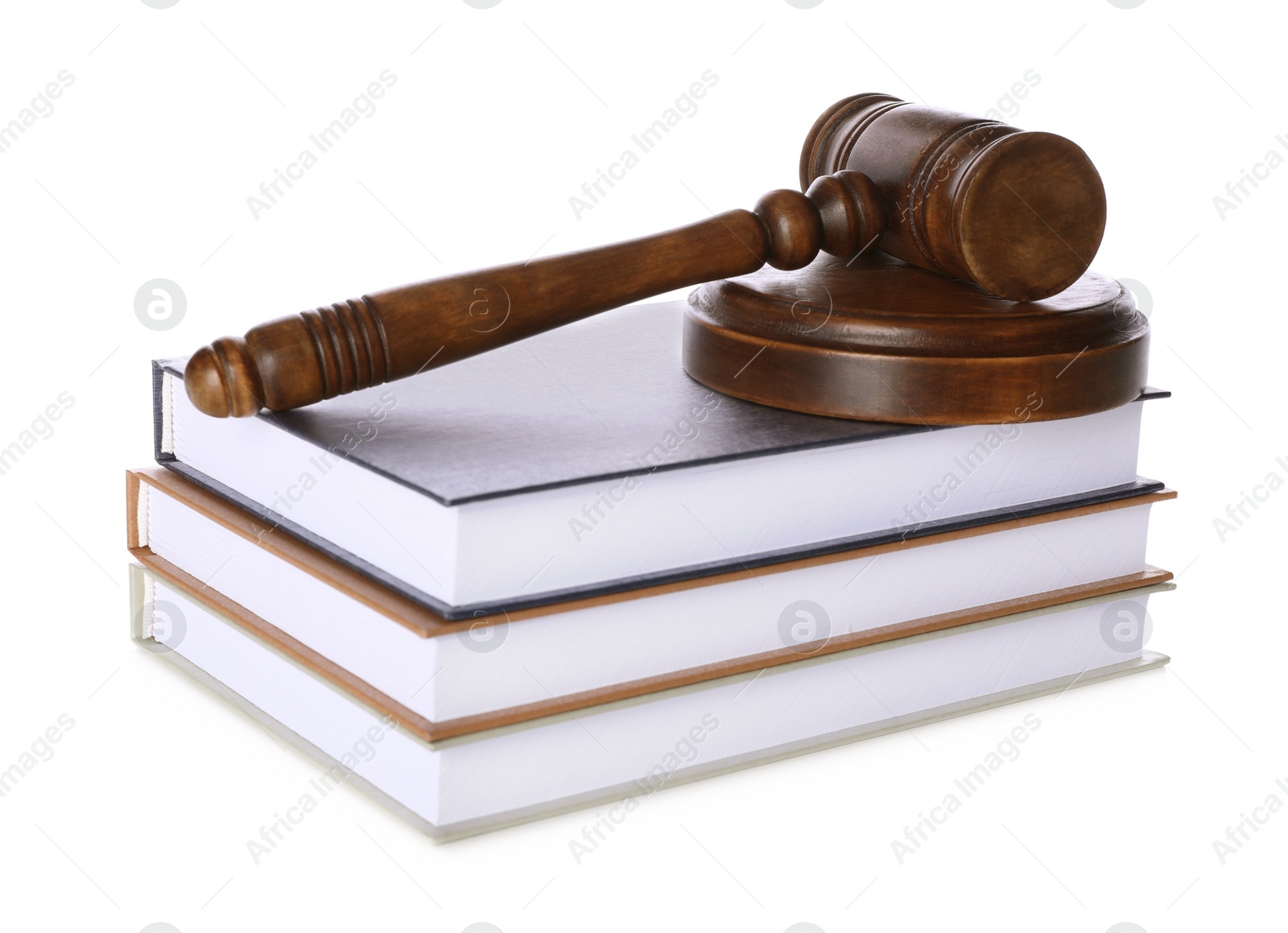 Photo of Wooden gavel and stack of books on white background