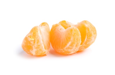 Photo of Pieces of ripe tangerine on white background