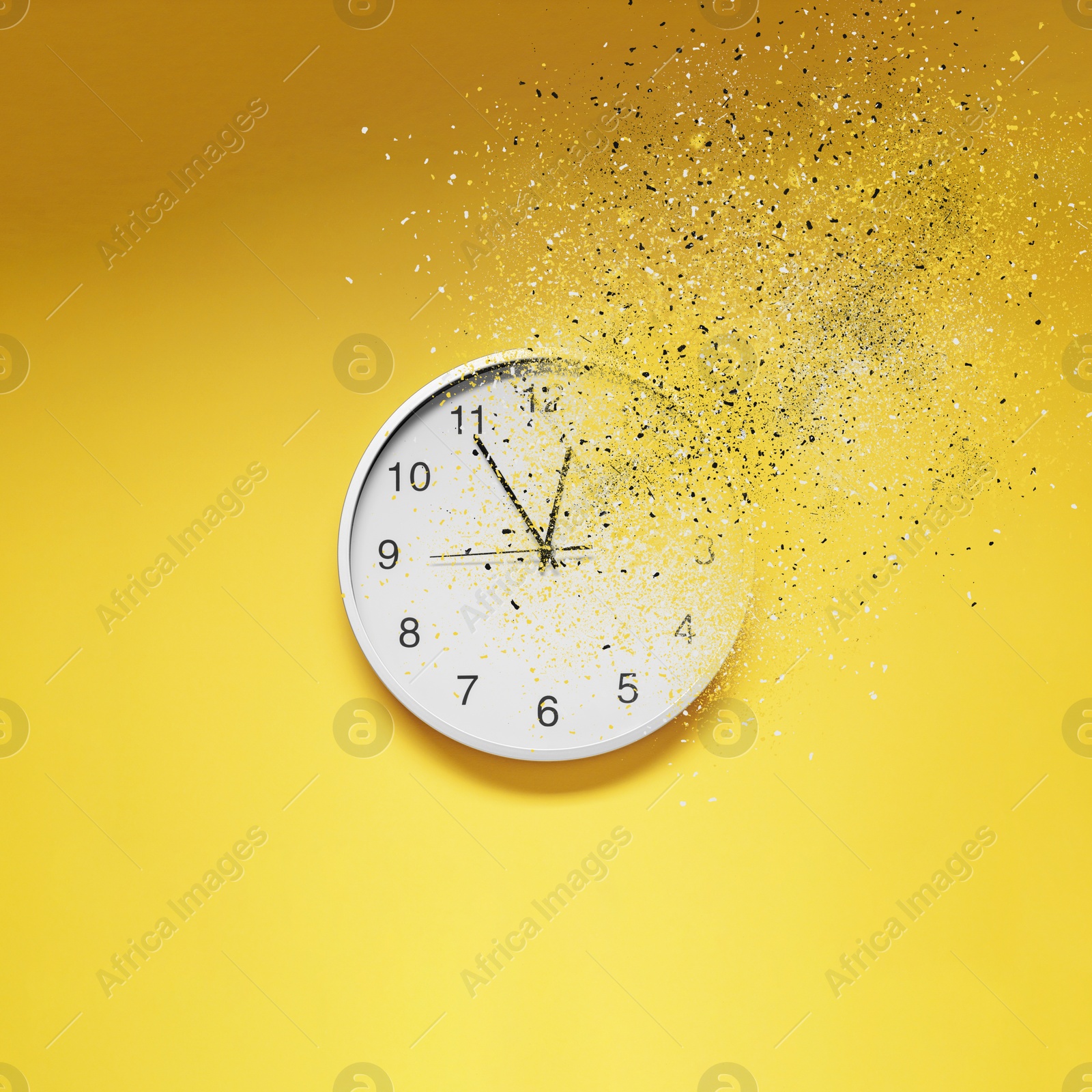 Image of Fleeting time concept. Analog clock dissolving on yellow background