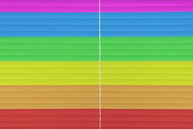 Image of Closed multicolor window blinds as background, closeup view