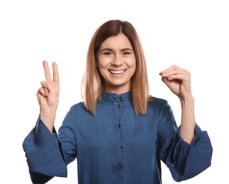 Woman using sign language on white background