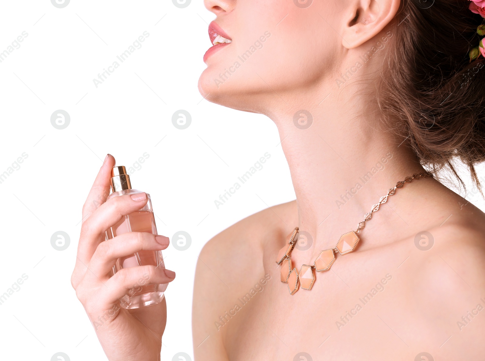 Photo of Beautiful young woman with bottle of perfume on white background, closeup