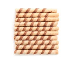 Photo of Tasty wafer roll sticks on white background, top view. Crispy food