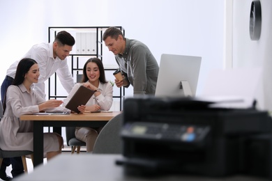 Group of employees working in modern office