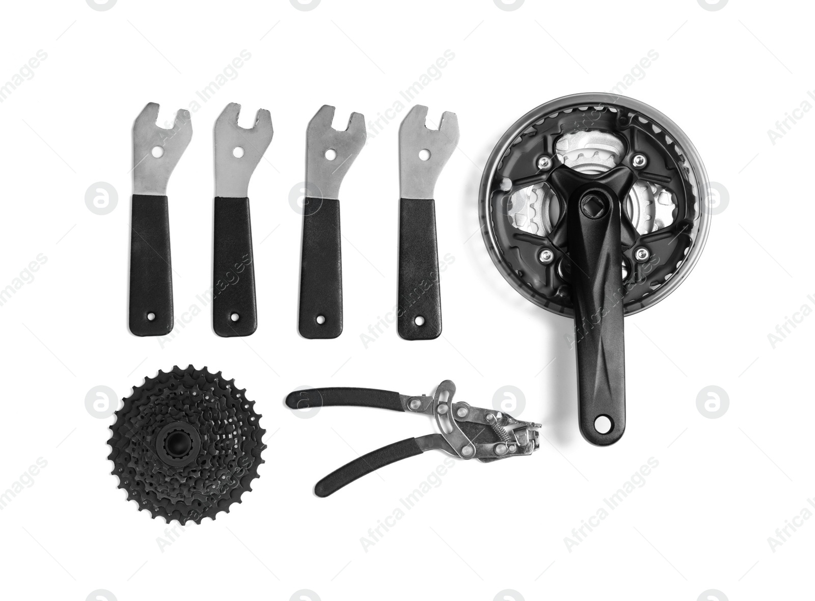 Photo of Set of different bicycle tools and parts on white background, flat lay