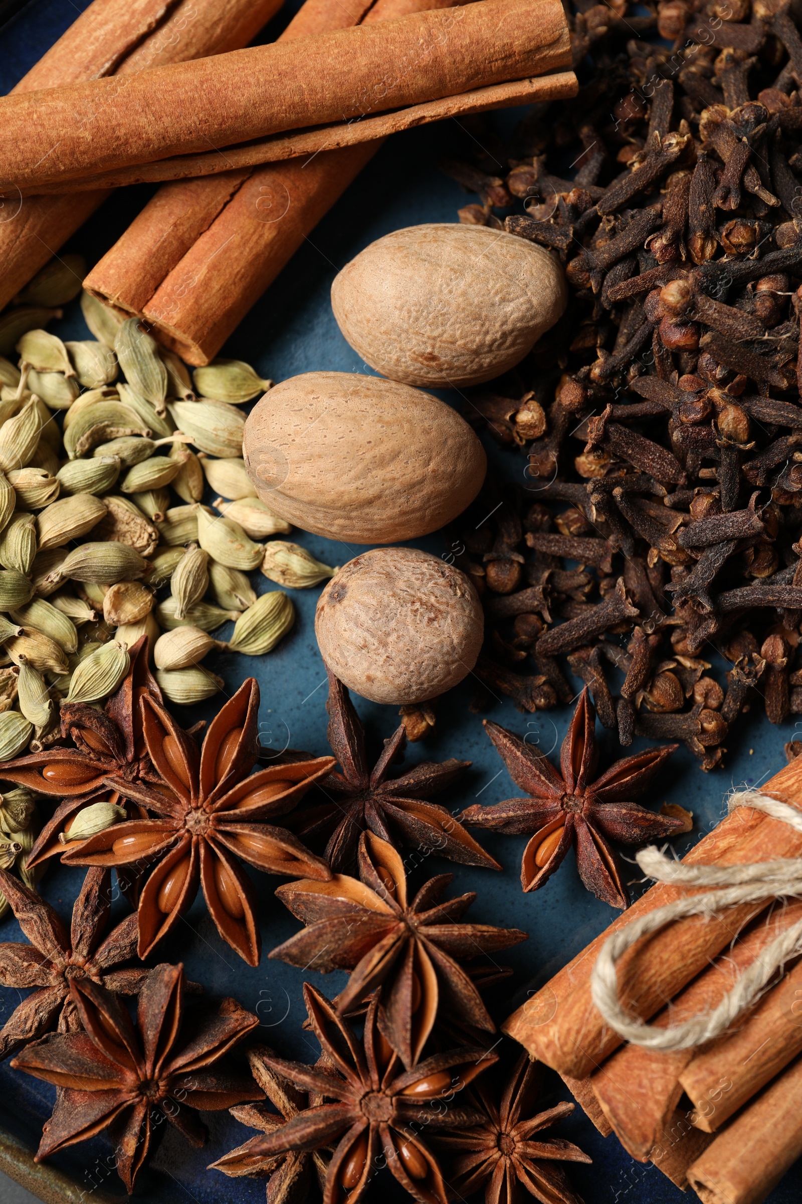 Photo of Different spices and nuts on table, top view