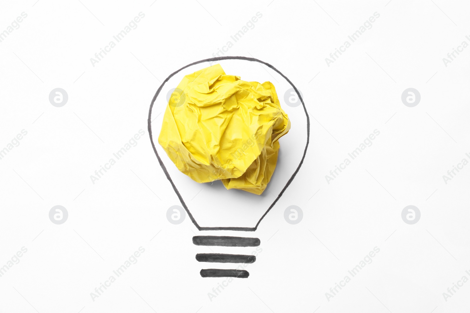 Photo of Creative idea. Drawing of lightbulb and crumpled yellow paper on white background, top view