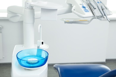 Photo of Clean spit sink in dentist's office. Space for text
