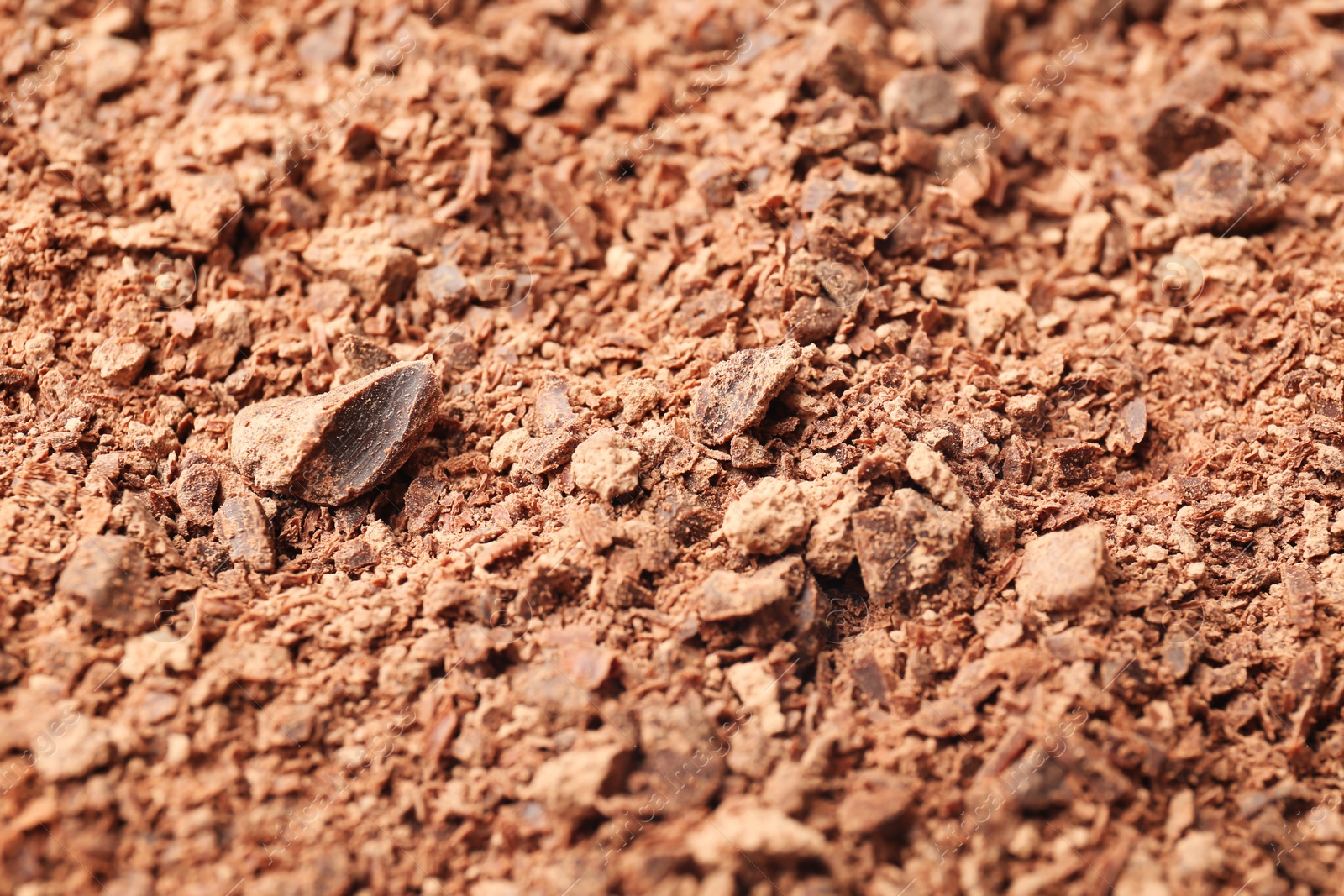 Photo of Delicious chocolate crumbs, closeup