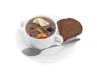 Photo of Meat solyanka soup served with bread isolated on white