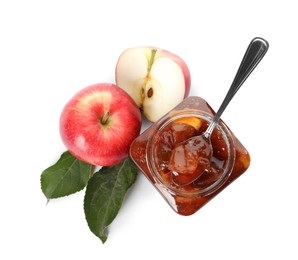Photo of Tasty apple jam and spoon in glass jar near fresh fruits on white background, top view