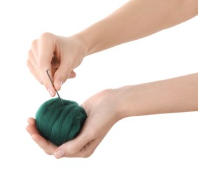 Photo of Woman needle felting from wool on white background, closeup