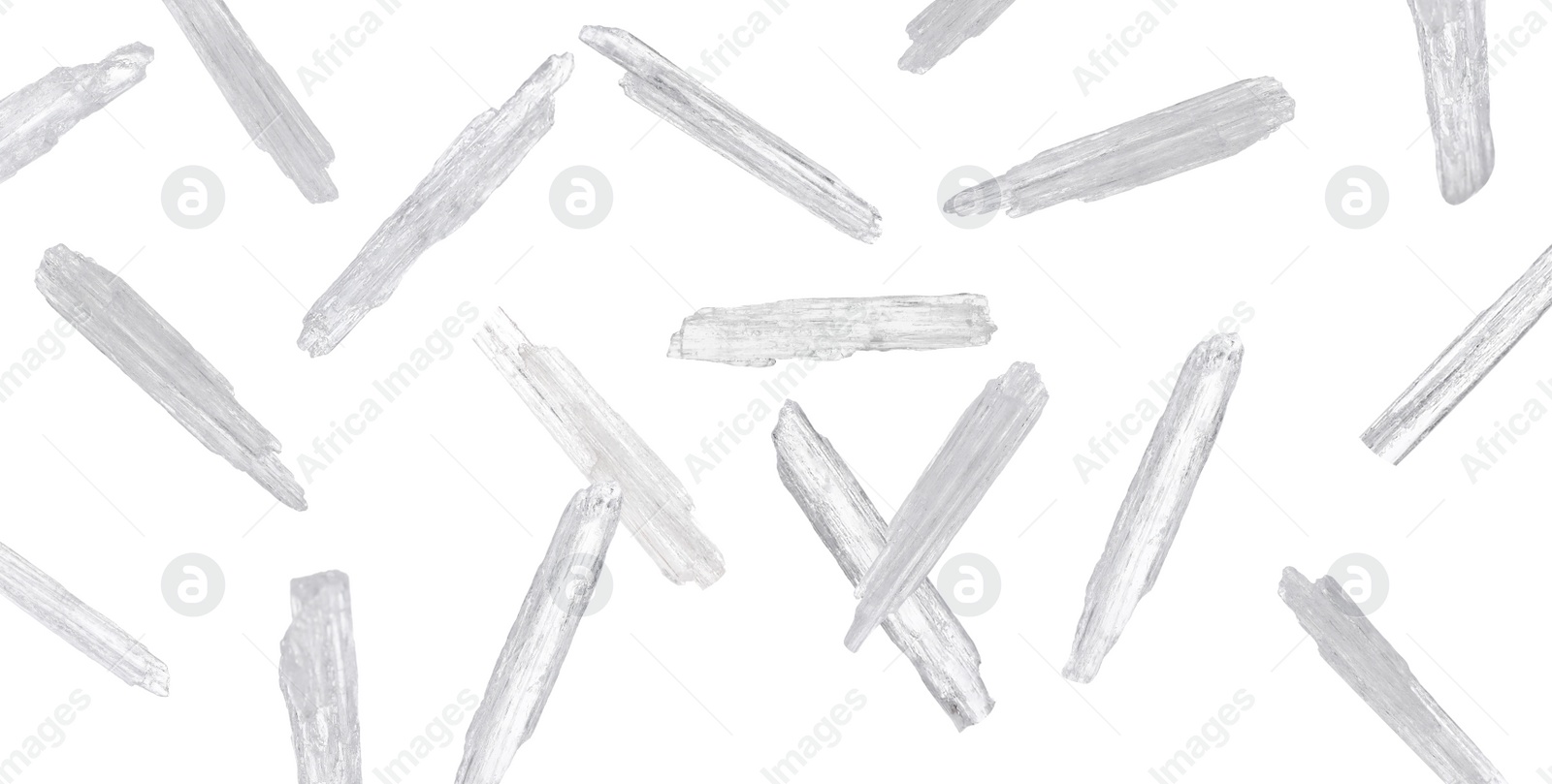 Image of Translucent menthol crystals falling on white background. Banner design