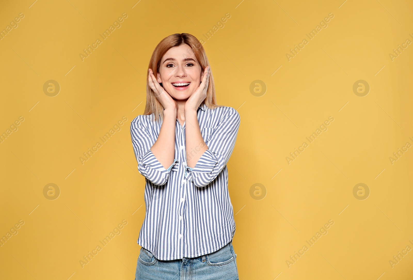 Photo of Portrait of emotional woman posing on color background. Space for text