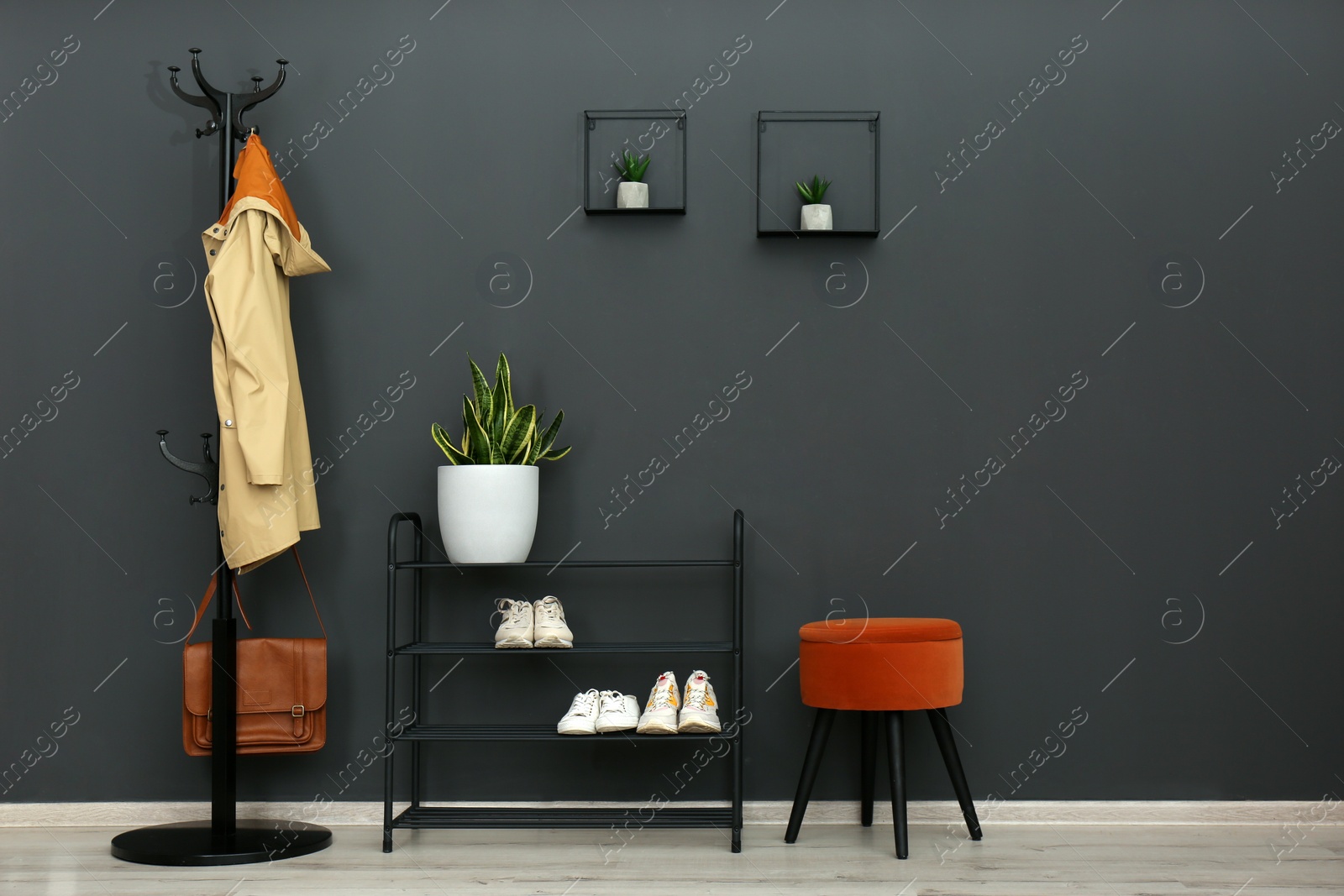 Photo of Hallway interior with stylish furniture, clothes and accessories