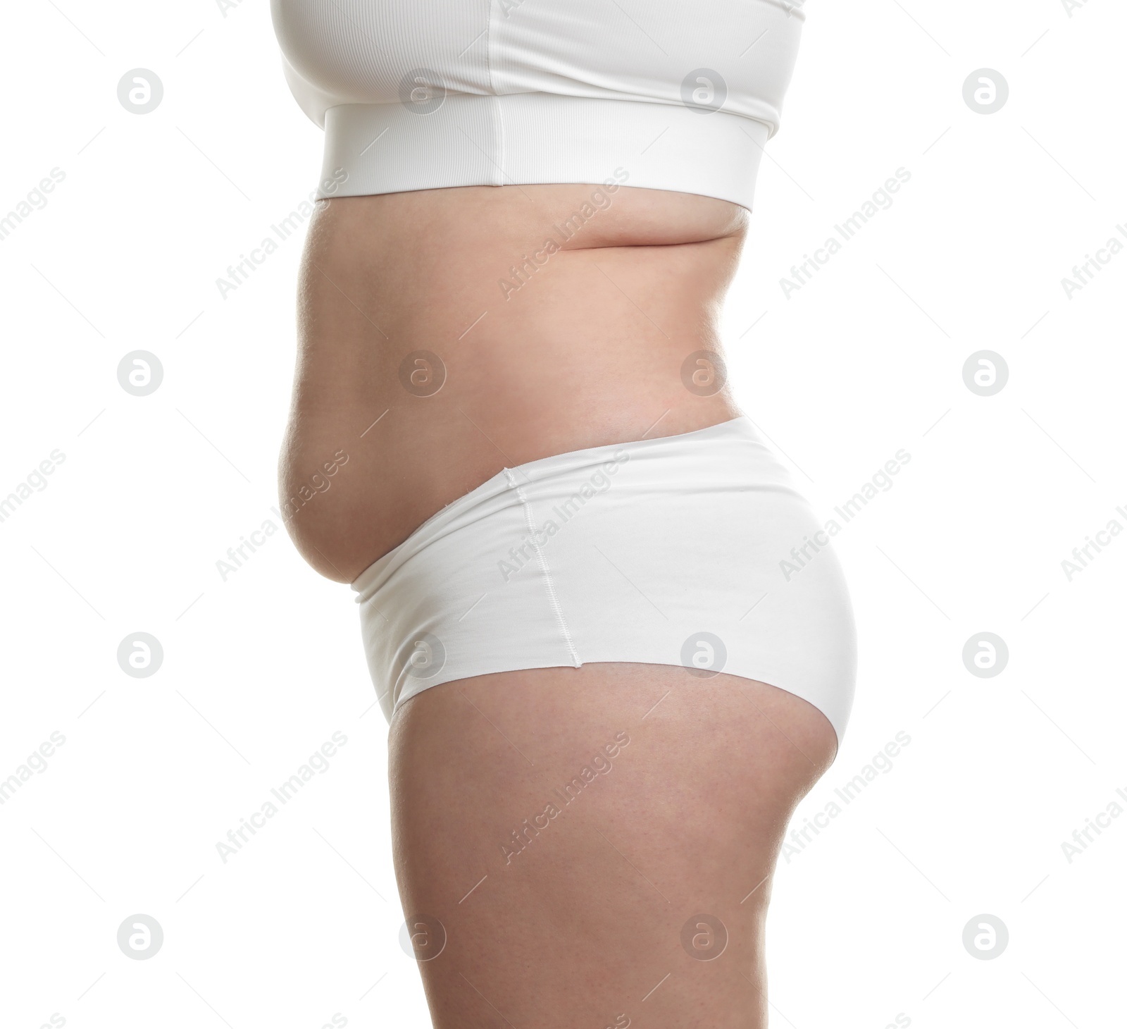 Photo of Woman with excessive belly fat on white background, closeup. Overweight problem