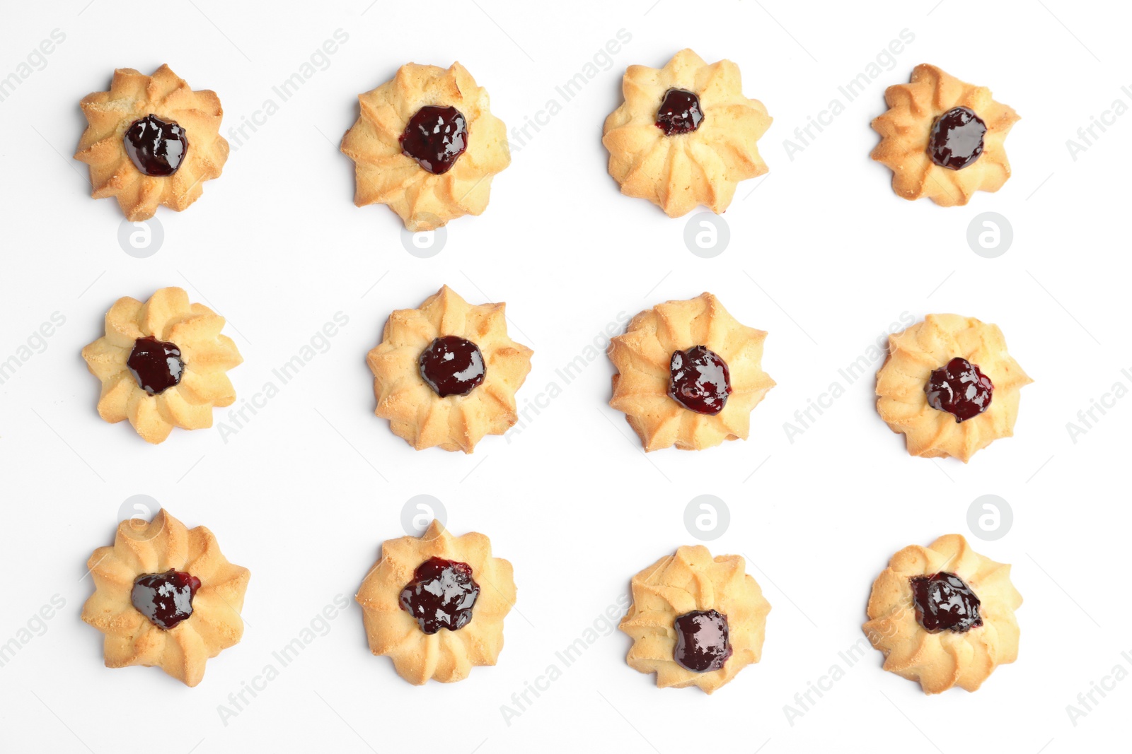 Photo of Tasty shortbread cookies with jam on white background, top view