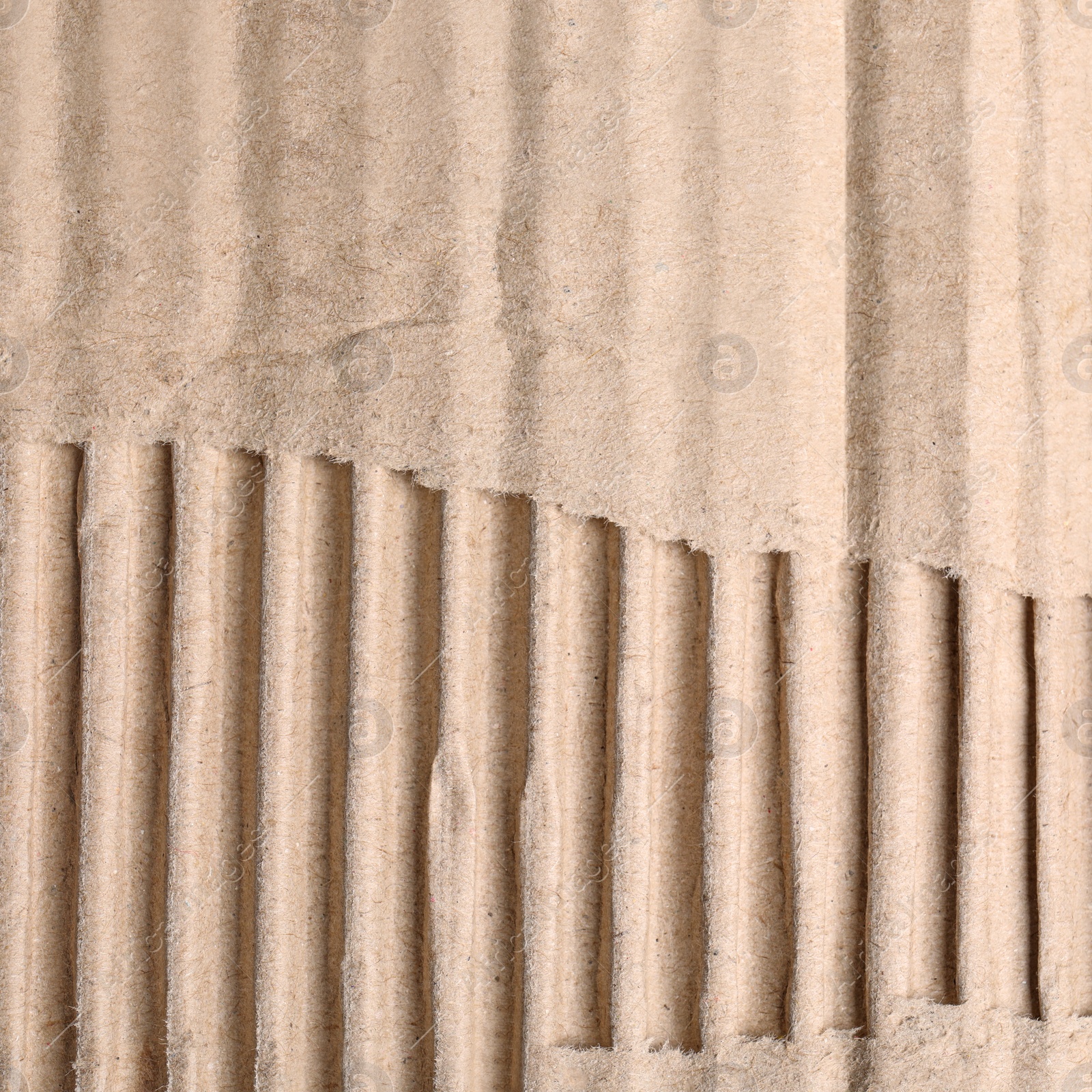 Image of Wall paper design. Brown corrugated sheet of cardboard as background