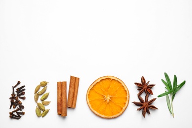 Photo of Different mulled wine ingredients on white background, flat lay. Space for text