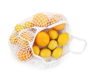 String bag with oranges and lemons isolated on white, top view