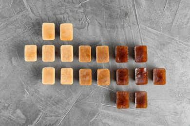 Photo of Flat lay composition with coffee ice cubes on grey background