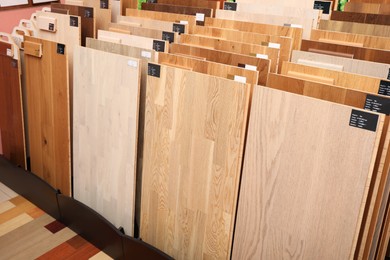 Photo of Many different samples of wooden flooring in store